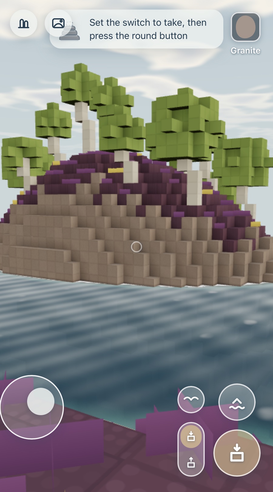 Holmvik on a phone: a granite islet with wind-bent birches, a thumb stick at the bottom left and the jump and build buttons at the bottom right.